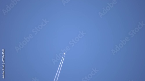 Aircraft Contrail Against Clear Blue Sky.