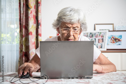 An elder lady using a laptop