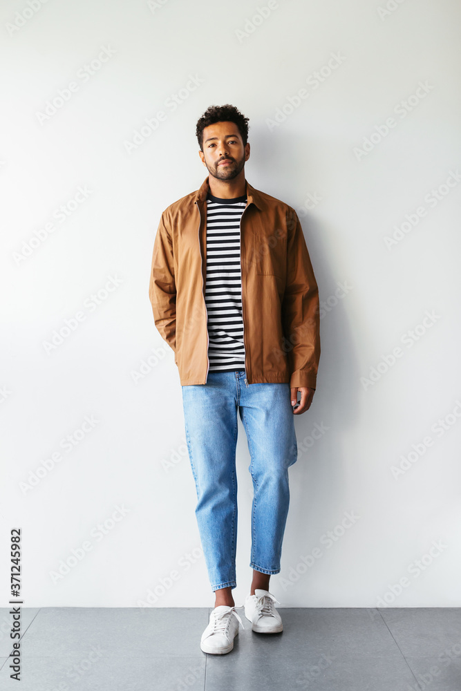 Relaxed office worker against white wall Relaxed office worker against white wall