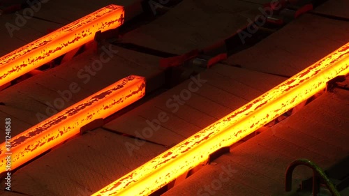 Red hot steel metal billets after molten steel casting. Continuous casting machine. Hot billet (bloom) continuous casting, also called strand casting
