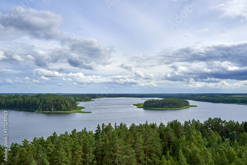Panoramic view with clouds over the lake in the forest