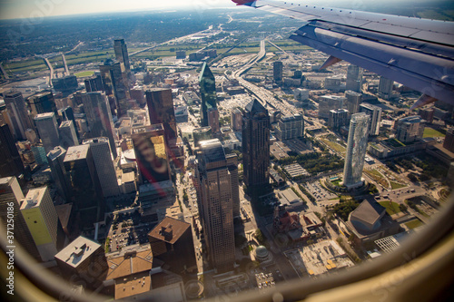 Dallas  Texas   aerial photo of downtown Dallas  Texas.  Photo taken from commercial airline  edge of window and wing of aircraft are visible.