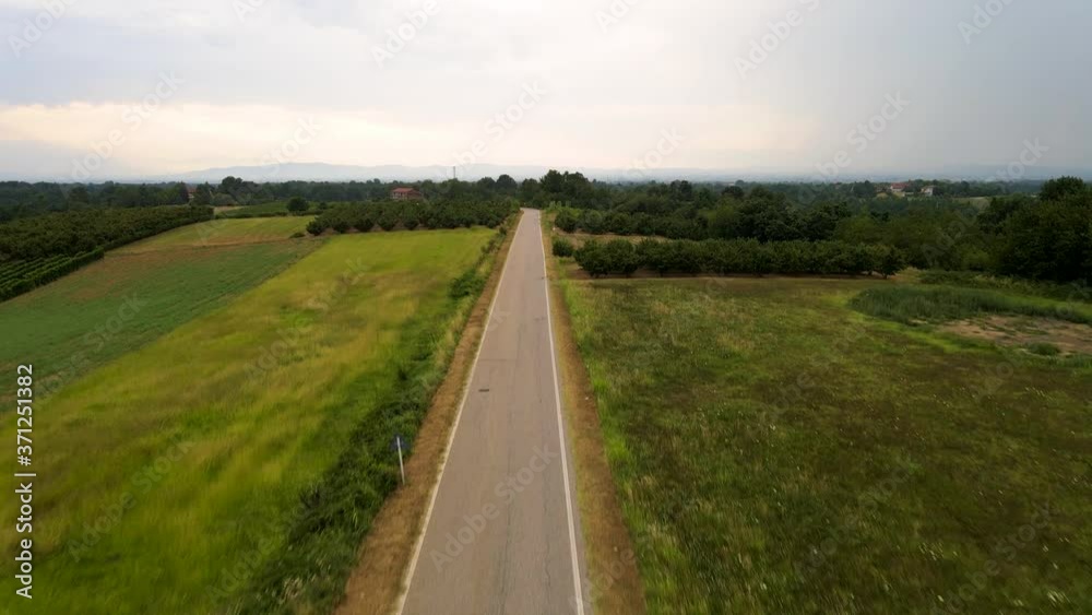 Drone view of country road and fields, Cellarengo, Italy