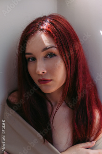 Portrait of pretty girl with long red hair. photo