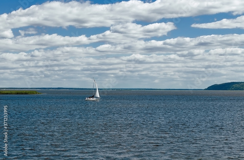 sailboat on the Dnipro river, on a warm summer day