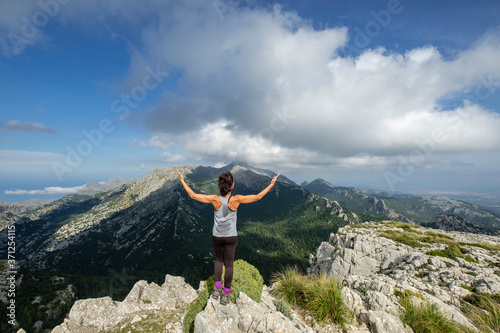 escursionista en la cima de Puig des Tossals Verds, 1118 mts, Escorca, Paraje natural de la Serra de Tramuntana, Mallorca, balearic islands, Spain