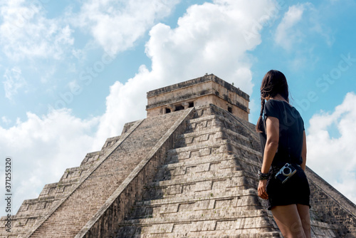 Tourist gazing a Mayan Pyramid On The Jungle