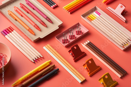 Multicolored stationery arranged on table photo