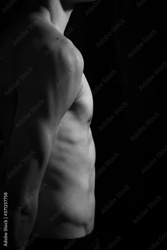 Medellín, Antioquia / Colombia. September 07, 2019. Muscular male torso on a black background
Medellín, Antioquia / Colombia. September 07, 2019. Muscular male torso on a black background