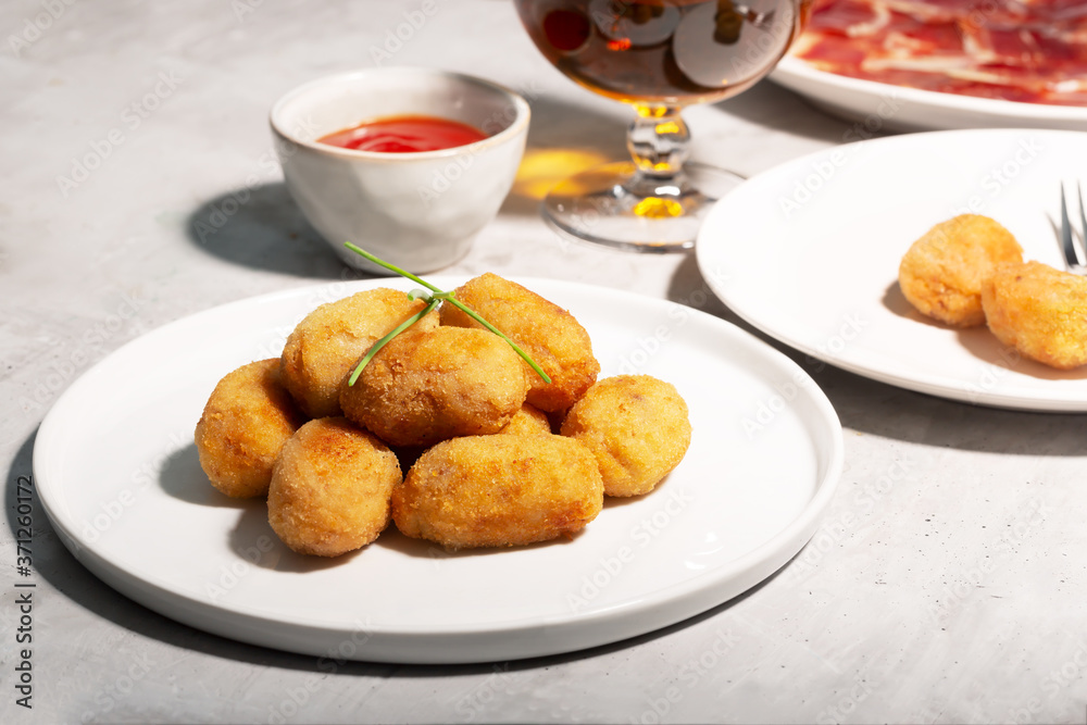 Tapas croquettes, traditional Spanish or French snack. Concrete background Tapas croquettes, traditional Spanish or French snack. Concrete background
