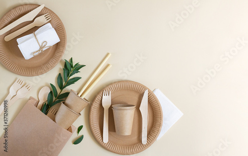Eco friendly disposable tableware made paper on beige background. Zero waste and recycling concept