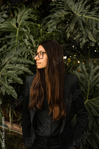 Portrait of content woman wearing business attire photo