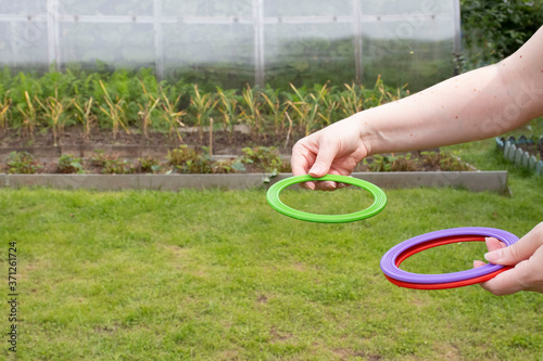 children's play ring toss on green grass