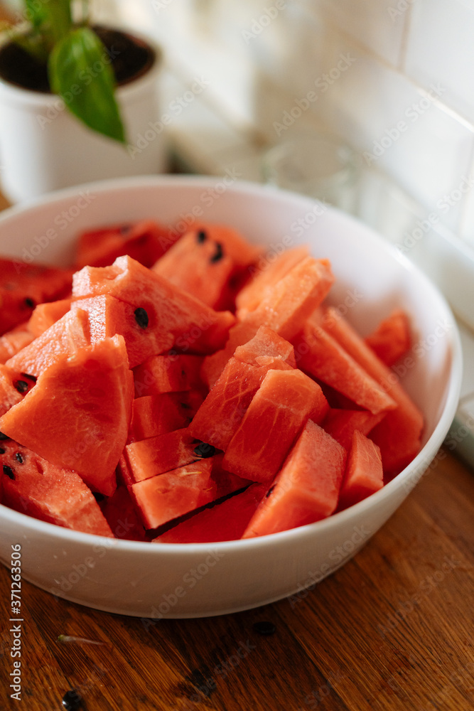 Big bowl with juicy watermelon on table