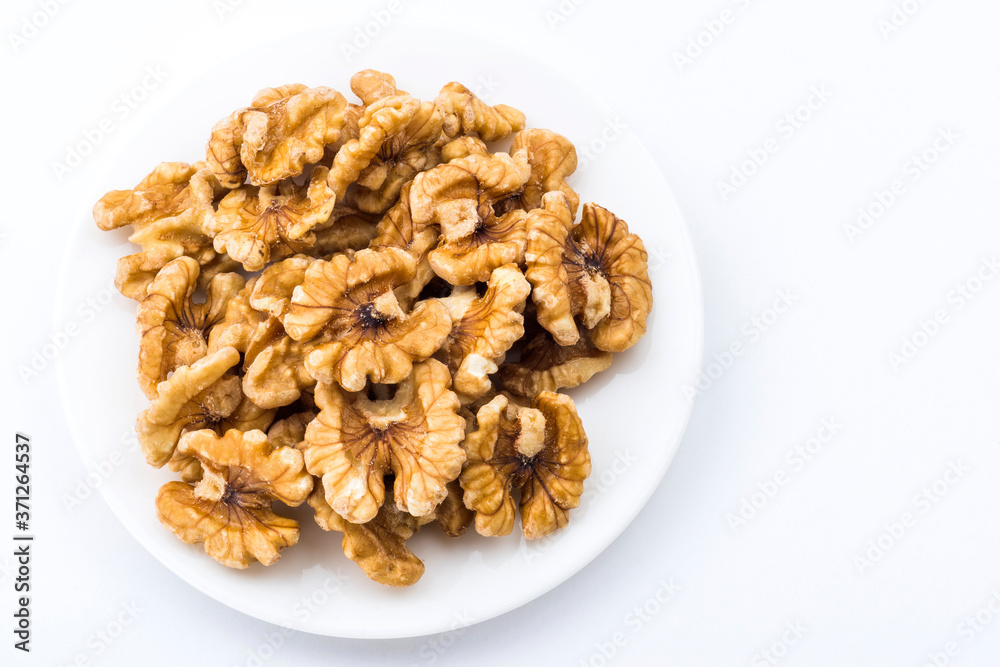 Close-up of delicious walnuts on a white dish