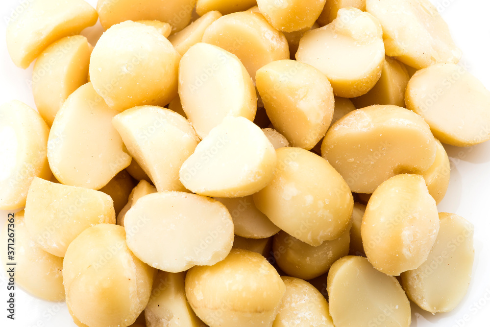 Close-up of delicious Macadamias on a white dish Close-up of delicious Macadamias on a white dish
