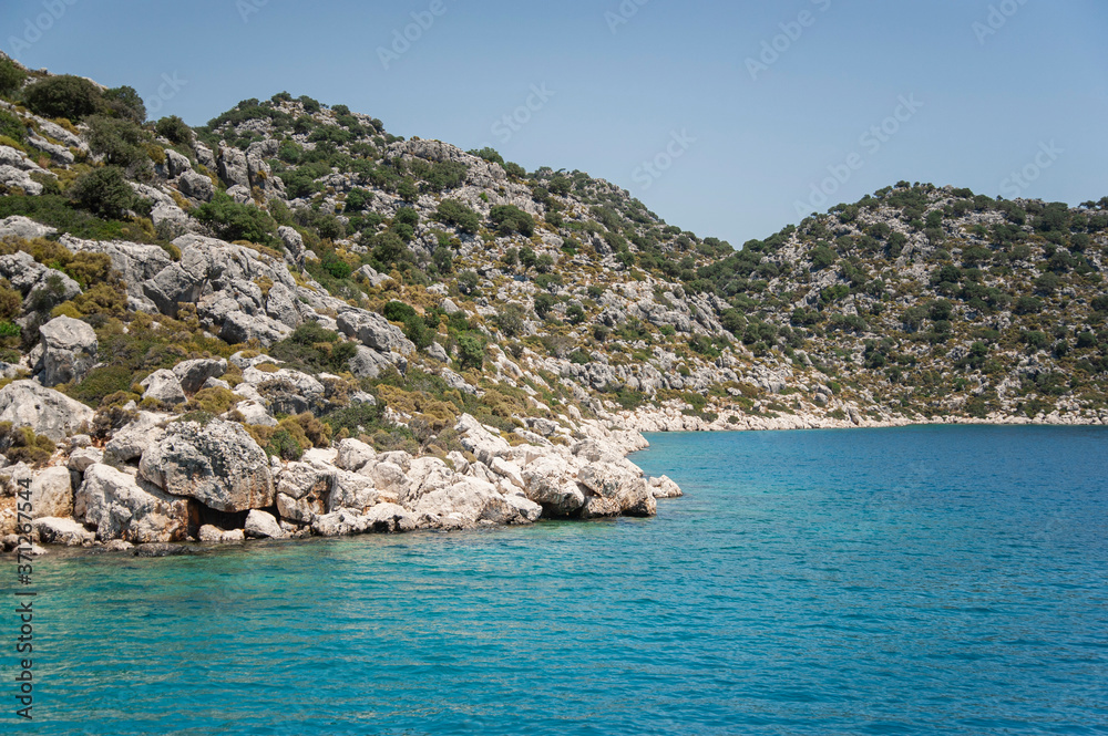 Aegean Sea with beautiful turquoise waters and rocky coastline. view from the sea Aegean Sea with beautiful turquoise waters and rocky coastline. view from the sea