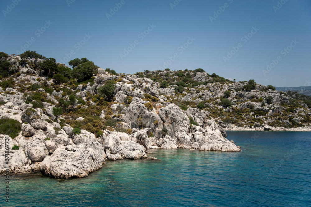 Aegean Sea with beautiful turquoise waters and rocky coastline. view from the sea