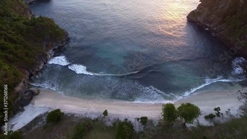 Tilt up over the dramatic Lawar beach of West Sumbawa Indonesia. photo