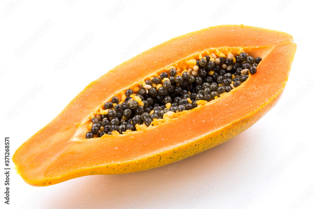 Close-up Papaya cut in half on the white background. Close-up Papaya cut in half on the white background.