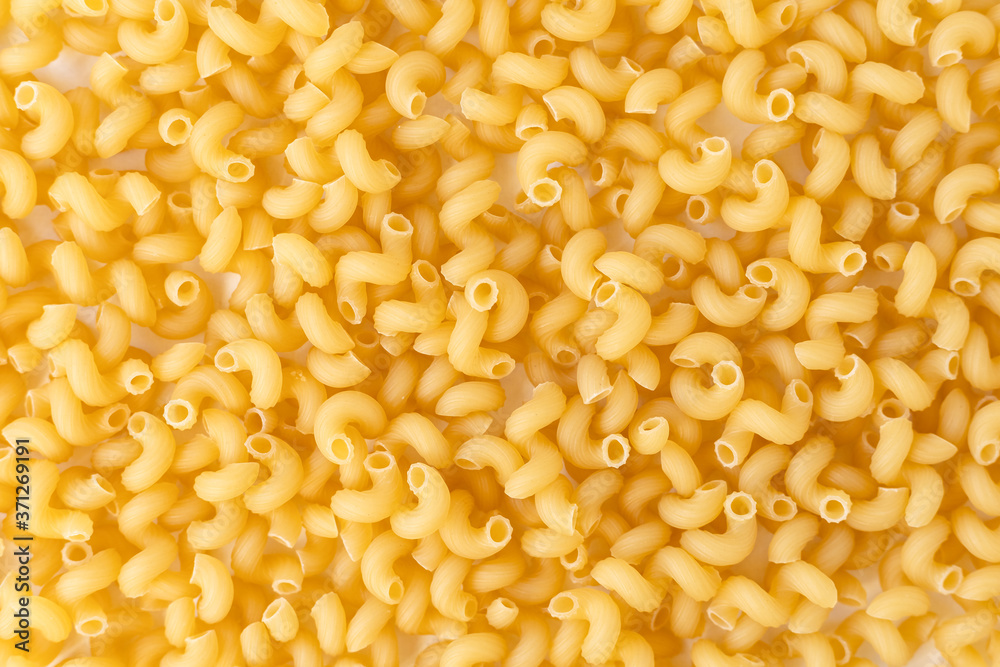 bright yellow pasta spirals, background, texture bright yellow pasta spirals, background, texture