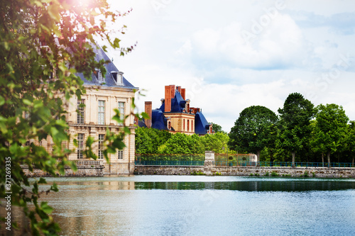 Scenic pond view in French king royal Fontainebleau palace, France