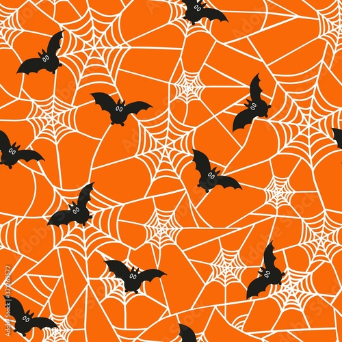 Vector seamless pattern for the Halloween holiday. Cobwebs and bats on an orange background. Horror texture  for party decor, wrapping paper, invitations.