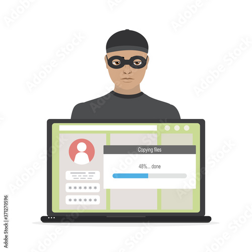 Man hacker in mask steals passwords and information. Spamming, virus detection. Hacker attack, scam alert. Laptop with unlock profile.