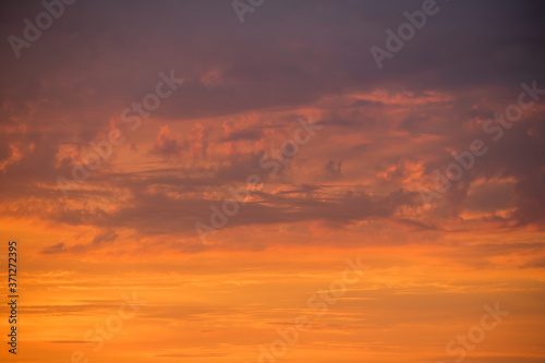 red and orange clouds floating in the sky © FlyVi