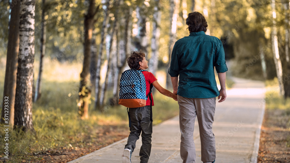 Fototapeta premium Parent and primary school students. beginning lessons.