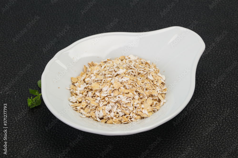 Raw oats in the bowl Raw oats in the bowl