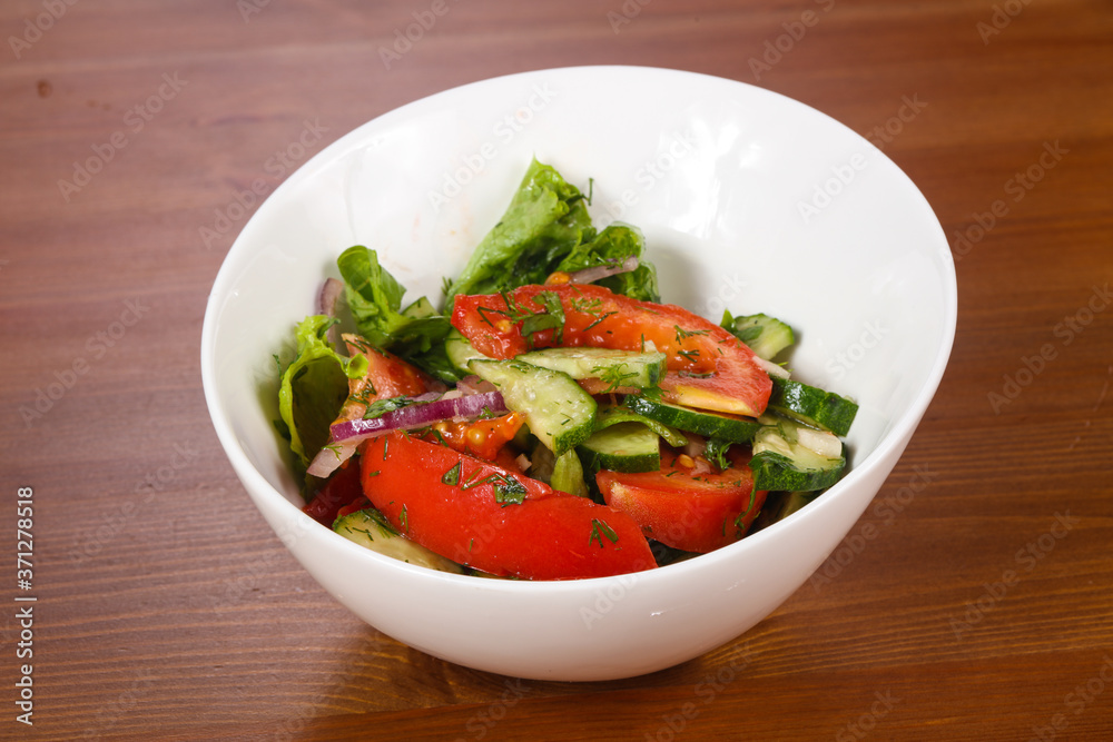 Vegetable salad with tomato, cucumbers Vegetable salad with tomato, cucumbers