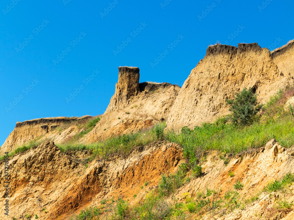 Landslide zone on Black Sea coast. Zone of natural disasters during rainy season. Large masses of earth slip along slope of hill, destroy houses. Landslide - threat to life