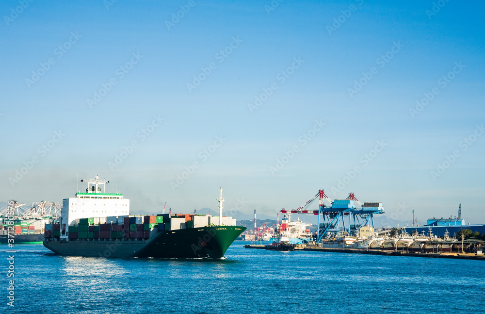 The container ship into the port of Kaohsiung, Taiwan. The container ship into the port of Kaohsiung, Taiwan.