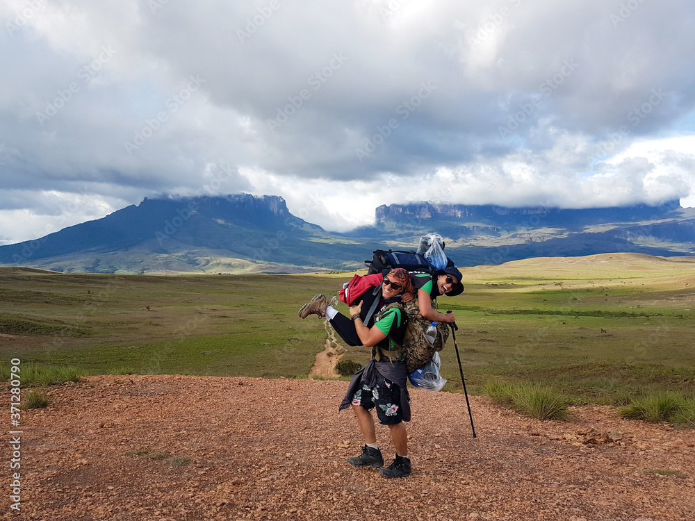 Young couple doing the hike on the trail to Monte Roraima