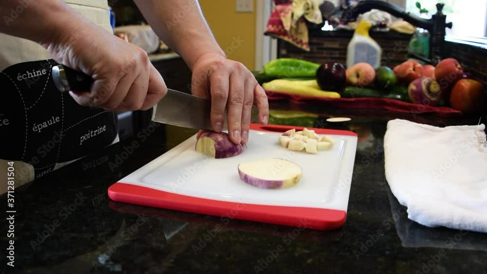 Man Cutting Food In The Kitchen Man Cutting Food In The Kitchen