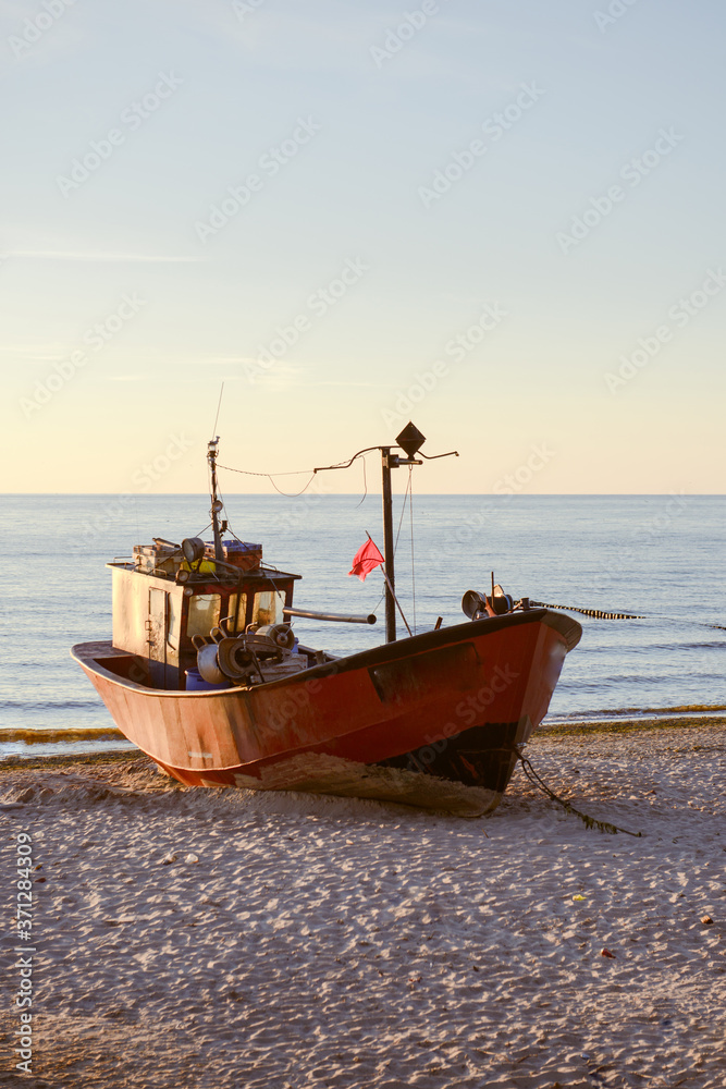 fisherman boats at sunrise time on the beach fisherman boats at sunrise time on the beach