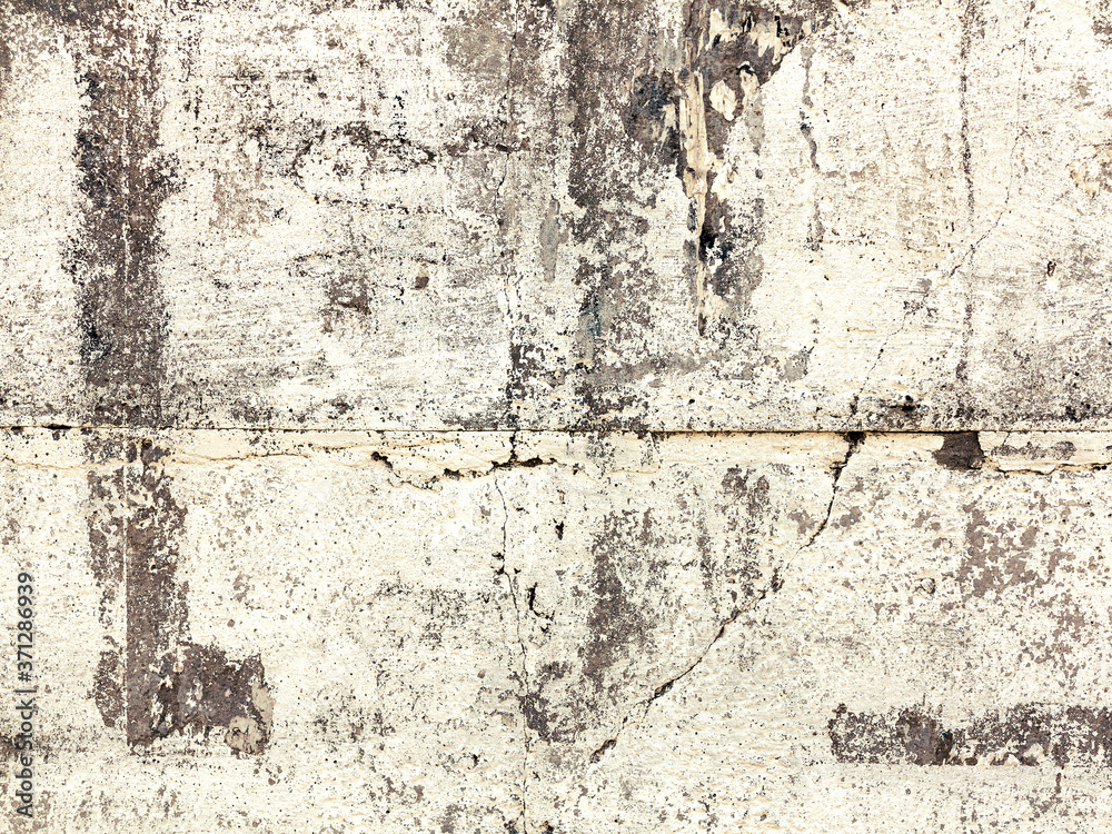 Fototapeta premium Background concrete wall, traces of weathering, worn wall damaged paint old paint. Remains of old paint on the painted concrete surface. Grungy concrete surface.