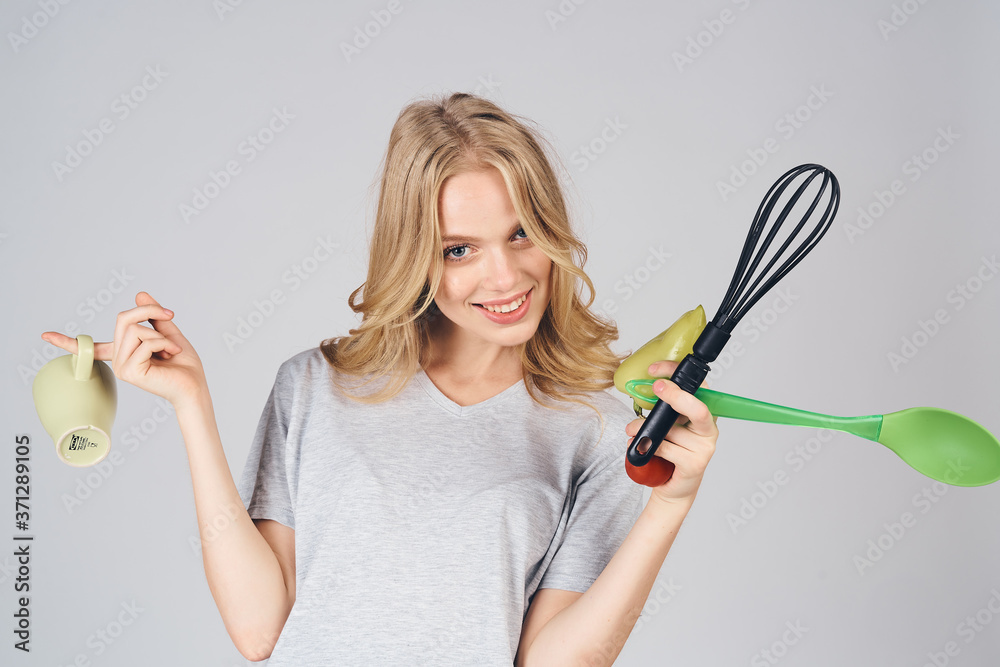 woman with kitchen appliances on gray background emotions model housewife cropped view woman with kitchen appliances on gray background emotions model housewife cropped view