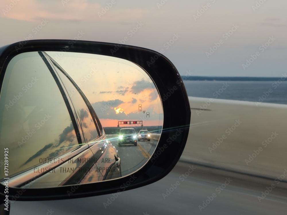 travel rearview mirror leaving vacation bridge driving road cars