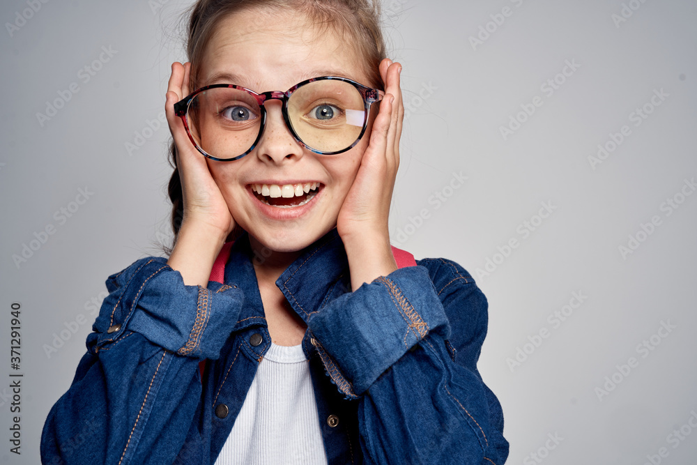 school girl with pink backpack swoosh pigtail fun learning light background school childhood
