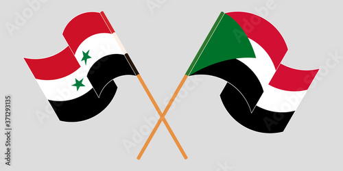 Crossed and waving flags of Syria and Sudan