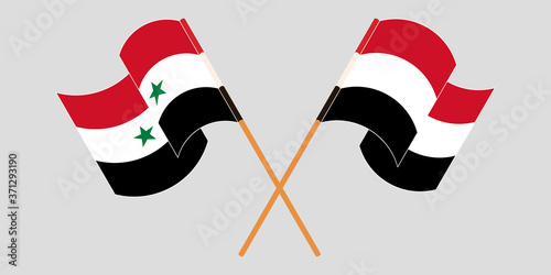 Crossed and waving flags of Syria and Yemen