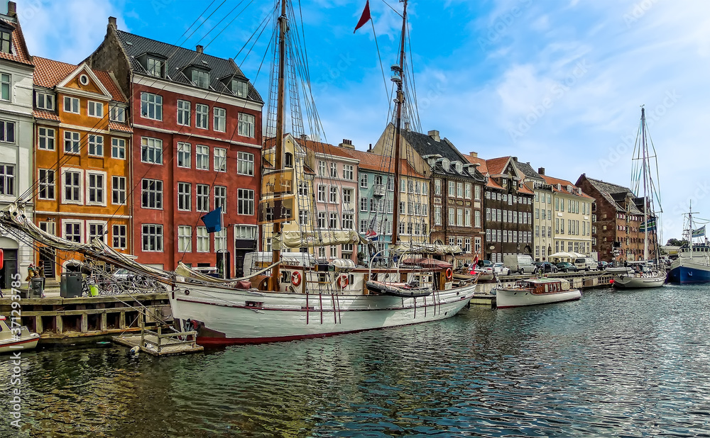 A view along the canal and waterfront in the district of Nyhavn in Copenhagen, Denmark in the summertime
