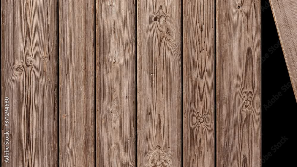 A background of unpainted wooden planks is assembled one by one. A background of unpainted wooden planks is assembled one by one.