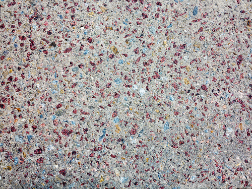 textured background concrete surfaces interspersed with small stones