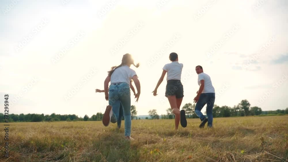 happy family children kids together run in park at sunset silhouette. people in park concept mom a dad daughter and son joyful run. parents and little baby child fun lifestyle summer vacation running happy family children kids together run in park at sunset silhouette. people in park concept mom a dad daughter and son joyful run. parents and little baby child fun lifestyle summer vacation running