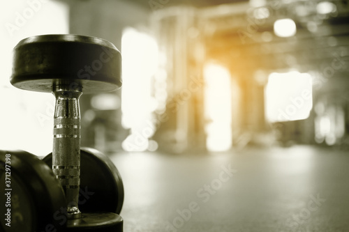 dumbbells with  Fitness Gym background