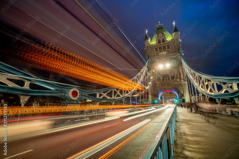 Tower Bridge and traffic light at twilight in London, UK