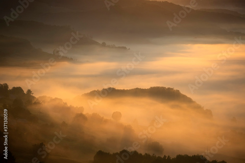 Magic sunrise in a Carpathian mountain valley
